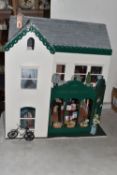 A 20TH CENTURY DOLLS HOUSE 'ANGEL ROW' DH1, two storey dolls house, featuring a white facade with