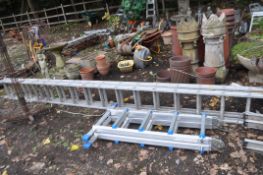 AN ALUMINIUM DOUBLE EXTENSION LADDER, with 16 rungs to each 400cm section, and a platform ladder