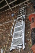AN ALUMINIUM DOUBLE EXTENSION LADDER, with 11 rungs to each 300cm section, a stand off and a step