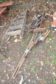 A WOODEN STEP LADDER AND A COLLECTION OF GARDENING TOOLS, including spades, shovels, rakes, hoes,