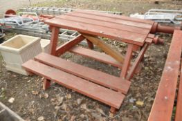A MODERN PINE PICNIC TABLE, top width 115cm, length 74cm, with two attached seats