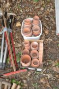 TWO TRAYS CONTAINING TERRACOTTA PLANT POTS, of varying sizes and ages