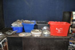 SIX BOXES CONTAINING VINTAGE CAR PARTS, including clocks, dials, radios, hub caps including four