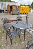 AN ALUMINIUM 110cm CIRCULAR TABLE AND FOUR MATCHING CHAIRS. Condition Report: repair to table and