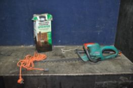 A BOSCH AHS40-24 ELECTRIC HEDGE TRIMMER with blade guard (PAT pass and working) and a shed