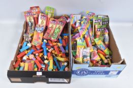 TWO TRAY OF PEZ BONBON DISPENSERS, large amount either still sealed in blister packs and bags or