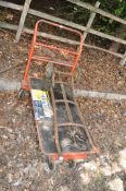 A FOUR WHEELED TROLLEY, with two rotating wheels, spring bed, length 144cm, along with a vintage