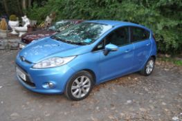 A 2011 FORD FIESTA ZETEC 5 DOOR HATCHBACK CAR, in blue with a 1242cc petrol engine, 5 speed manual