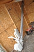 AN ACORN STAIRLIFT, with a 340cm straight track, two remote controls and manual (removed from
