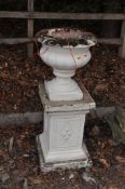 A CONCRETE GARDEN URN ON STAND, with fluted bowl, square footing, rectangular base with geometric