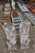 A PAIR OF JAPANESE STYLE CARVED STONE GARDEN FIGURES, an opposing pair standing 80cm high. Condition