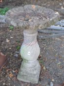A CONCRETE SHELL TOP BIRD BATH, on a spiral base, diameter 52cm x height 80cm, condition report: