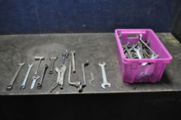 A PLASTIC BOX CONTAINING A LARGE VARIETY OF SPANNERS, WRENCHES AND MOLE GRIPS