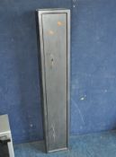 A MODERN STEEL GUN CABINET, with two pairs of keys and two locks, width 23cm, depth 16cm, height