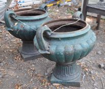 A PAIR OF CAST IRON CAMPAGNA URNS, with twin handles, on square bases, diameter 44cm x height