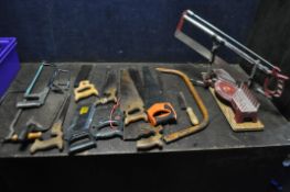 A TRAY CONTAINING A VARIETY OF SAWS, including a mitre saw, and an assortment of hand held saws,