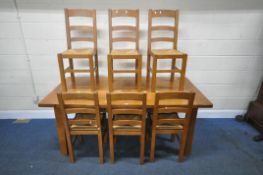 A SOLID OAK RECTANGULAR FARMHOUSE STYLE TABLE, two drawers to one long edge, raised on square
