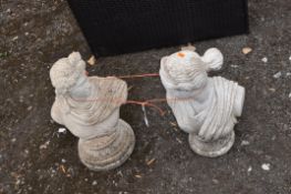 TWO MODERN CONCRETE GARDEN BUSTS in the form of Roman male and female, 55cm and 50cm high