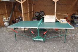 A KETTLER SPORTS FULL SIZED FOLDING TABLE TENNIS TABLE, with table tennis buddy, a practice net