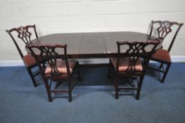 BERESFORD AND HICKS OF ENGLAND, A REPRODUCTION MAHOGANY EXTENDING DINING TABLE, with one