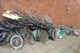 A LARGE QUANTITY OF BIKE PARTS including frames, wheels, rear and front racks, handlebars by