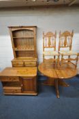 A MODERN PINE GATE LEG TABLE, diameter 113cm x width 23cm x height 74cm, a pair of chairs, a Ducal