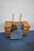 LEBUS, A 20TH CENTURY OAK DRESSING TABLE, with a single mirror, a hidden pull out section, and