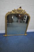 A GILT WOOD ARCHED OVERMANTEL MIRROR, with a foliate crest, width 123cm x height 125cm, condition