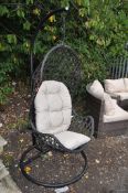 A METAL FRAME BASKET WEAVE SWINGING EGG GARDEN SEAT, height 194cm. Condition Report: no obvious