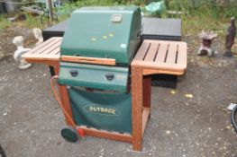 AN OUTBACK TROOPER BARBECUE, on a teak stand with gas regulator and two burners. Condition Report: