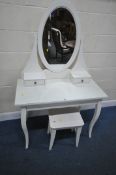 A MODERN WHITE DRESSING TABLE, with an oval mirror, two drawers, and a glass protective surface,