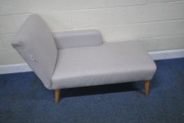 A MODERN CHAISE LOUNGE, raised on cylindrical tapered legs, length 136cm x depth 65cm x height 87cm,