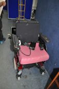 AN INVACARE ELECTRIC WHEELCHAIR (SPARES OR REPAIRS) with charger (PAT pass and working but chair