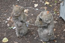 TWO CONCRETE GROTESQUES both seated on tree stumps the tallest being 49cm high. Condition Report: no