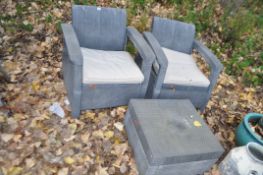 A PAIR OF GREY RATTAN STYLE GARDEN CHAIRS and a matching coffee table (3). Condition Report: dirty