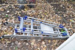THREE SETS OF ALUMINIUM STEP LADDERS including a set by Werner 43cm high