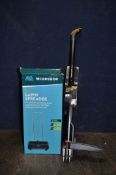 A FISKARS WEED PULLER brand new and still packaged and a boxed McGregor lawn seeder (2)