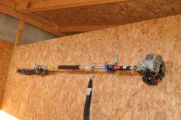 AN ECHO HCA-2400 PETROL POLE HEDGE TRIMMER with strap (engine pulls freely but hasn't been started)