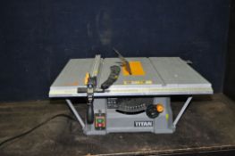 A TITAN TTB674TAS 10in TABLE SAW with parallel guide and push stick (PAT pass and working)
