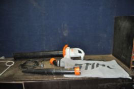 A STIHL SHE 71 GARDEN BLOWER VAC with collection bag and out pipe (PAT pass and working)
