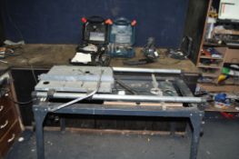 A WOLFCRAFT MASTER CUT SAW TABLE AND BLACK AND DECKER TOOLS including a circular saw, an orbital