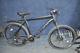 A CARRERA VENGEANCE 27.5 GENTS BIKE in matt black with 16 speed Shimano gears, front and rear disc
