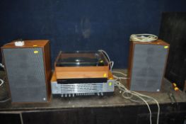 A VINTAGE BUSH ARENA HI FI comprising of a Garrard AP76 turntable, tuner amplifier and a pair of