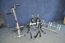 A SARIS CAR BOOT BICYCLE CARRIER, a Mottez three bike rack and an exercise machine (3)