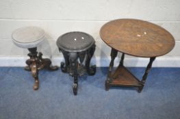 A 20TH CENTURY OAK DROP LEAF CRICKET TABLE, with foliate carved details, raised on block and