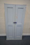 A BLUE PAINTED PINE DOUBLE DOOR CUPBOARD, width 96cm x depth 37cm x height 191cm, condition