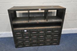 A GREEN PAINTED INDUSTRIAL METAL SHELVING UNIT, fitted with twenty-four drawers, width 92cm x