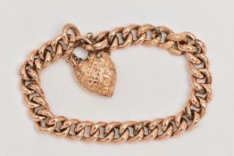 A LATE VICTORIAN BRACELET, a yellow metal hollow curb link chain bracelet with embossed detail to