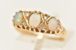 AN 18CT GOLD THREE STONE OPAL RING, three oval opals prong set in yellow gold, with single cut