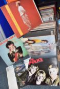 A QUANTITY OF LP RECORDS IN TWO BOXES AND A RECORD CASE, artists include The Police, Depeche Mode,